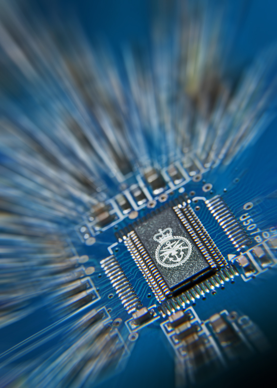 The UK Ministry of Defence badge on a computer chip. Contains public sector information licensed under the Open Government Licence v3.0